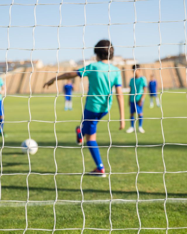 A young goalkeeper by the net