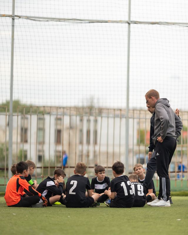 Young players on the sideline during a session