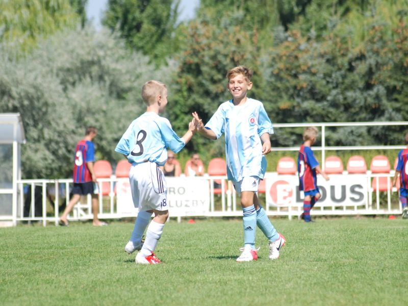 Two young opponents sharing a high-five after a match